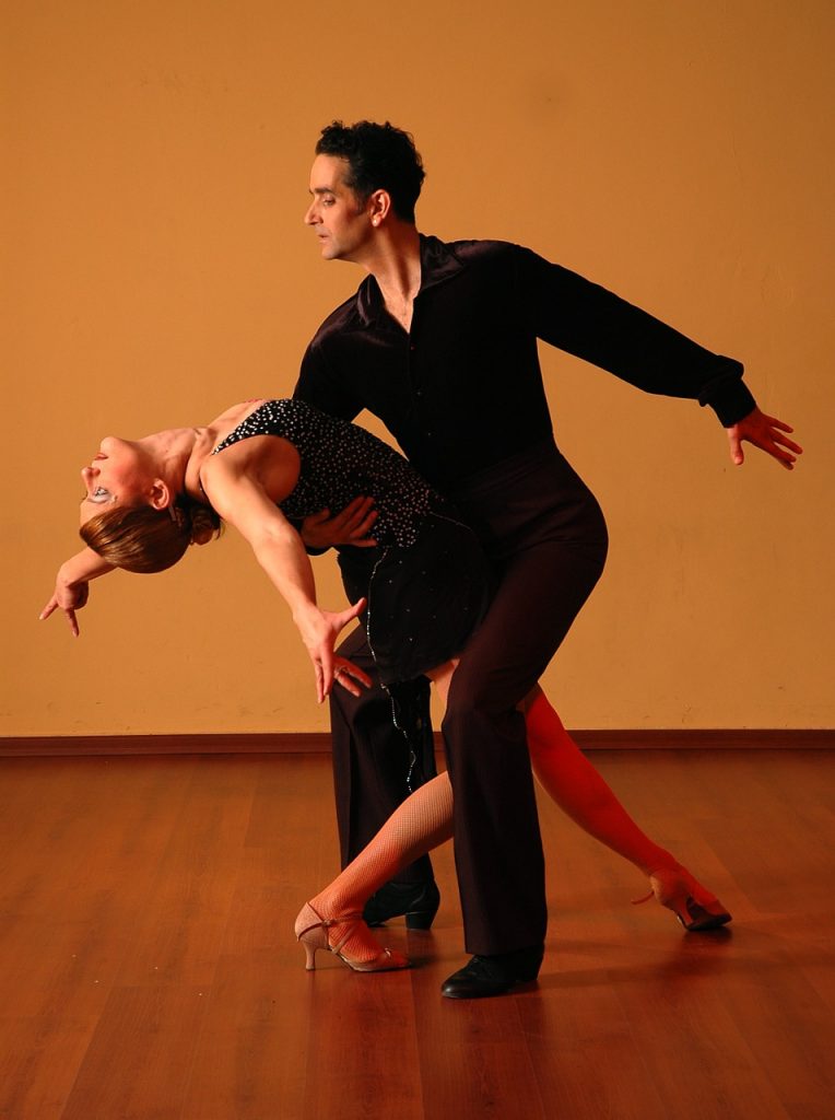 a man and woman dancing