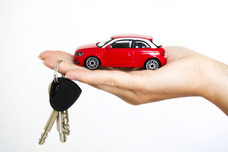 a hand holding a key chain