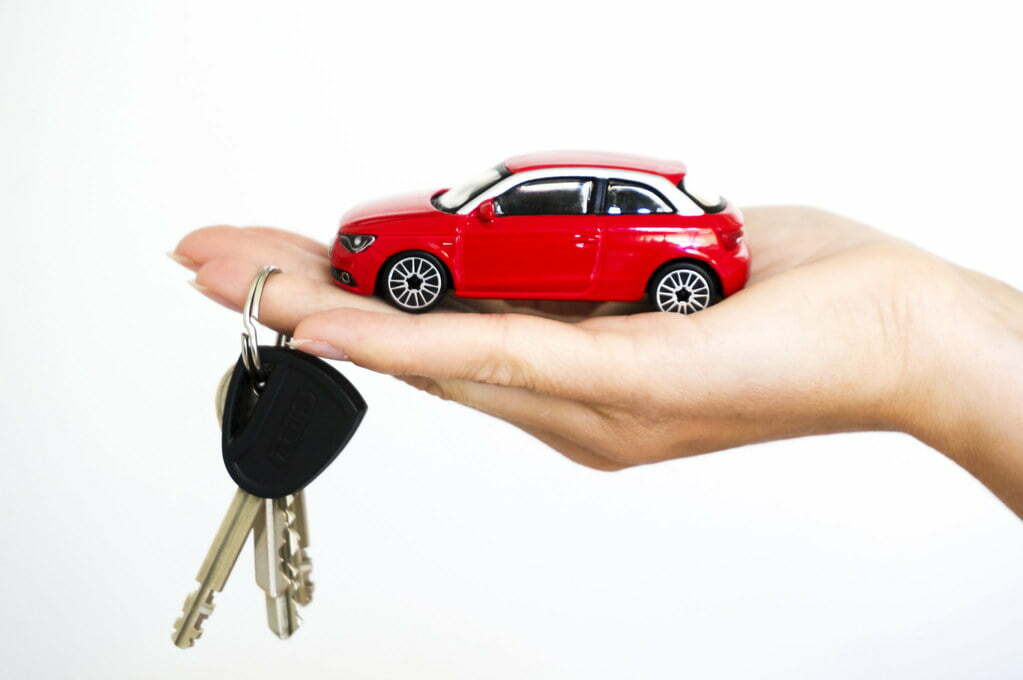 a hand holding a key chain