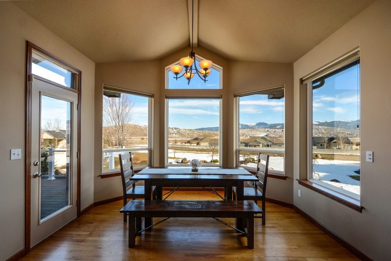 a dining room with a large window