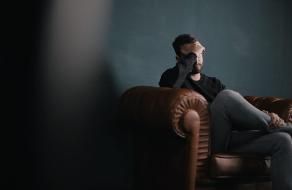 a man and woman sitting on a couch