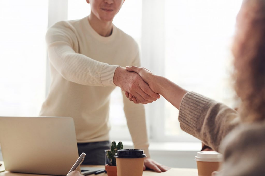 a person holding a person's hand