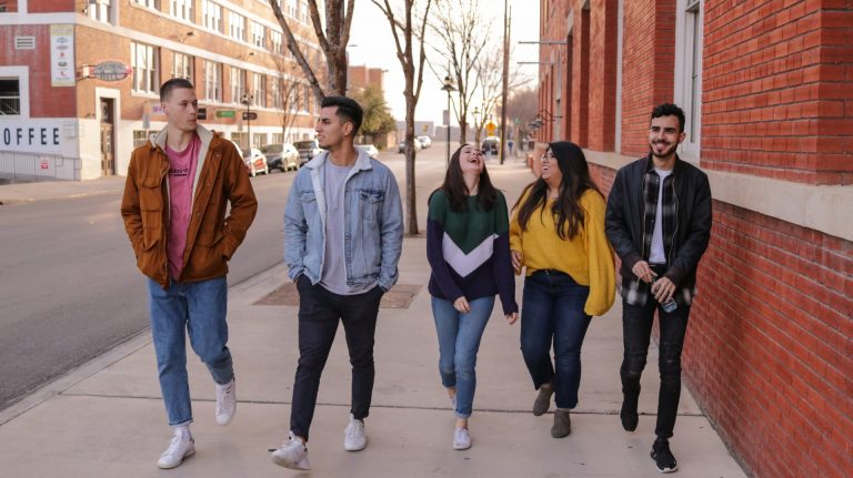 a group of people walking down a street