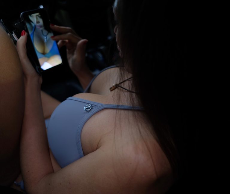 a woman holding a cell phone