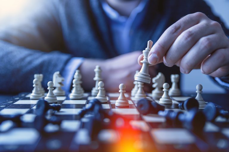 close-up of a person playing chess