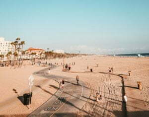 a beach with people and trees