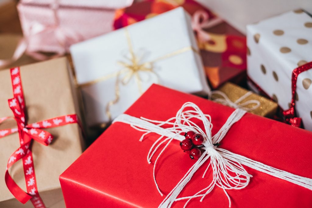 a red box with a ribbon and a bow