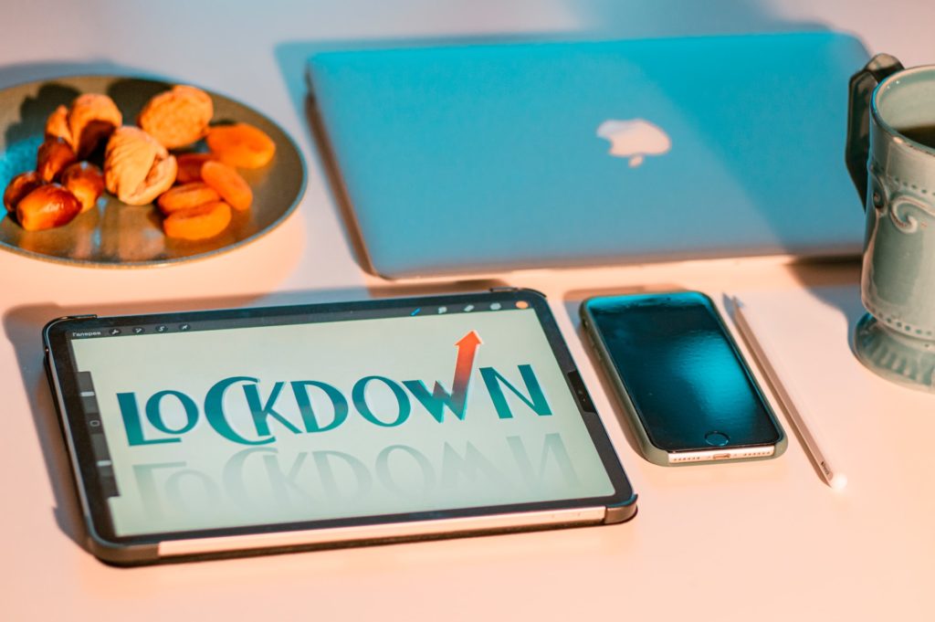 a plate of fruit next to a cell phone