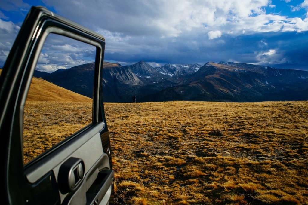 a car window overlooking a valley