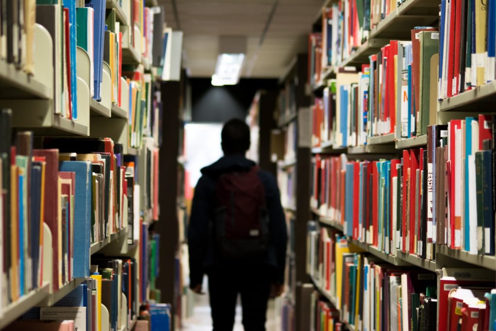 a person walking in a library