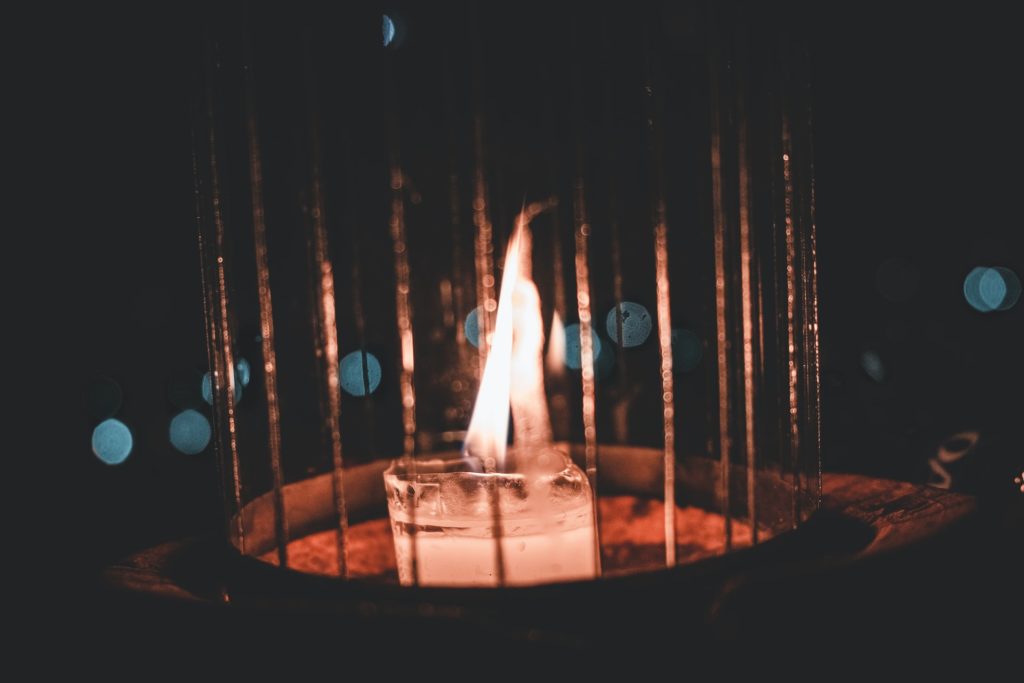 a large flame in a dark room