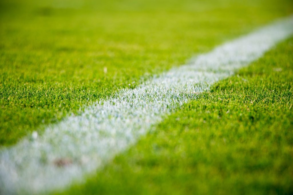 a white line on a green field