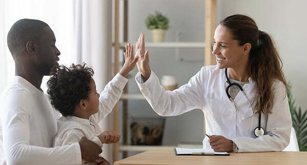 a doctor giving a patient a high five