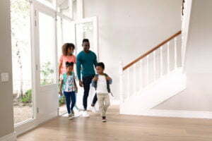 a family walking down a staircase