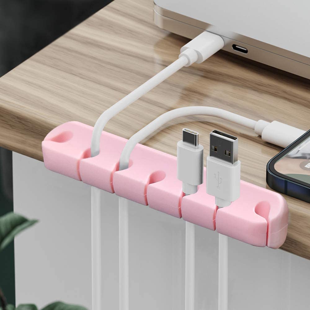 a pink and white cord plugged into a white electrical device