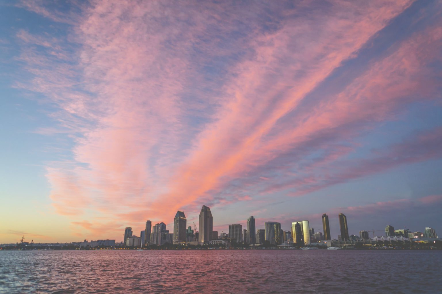 a city skyline at sunset