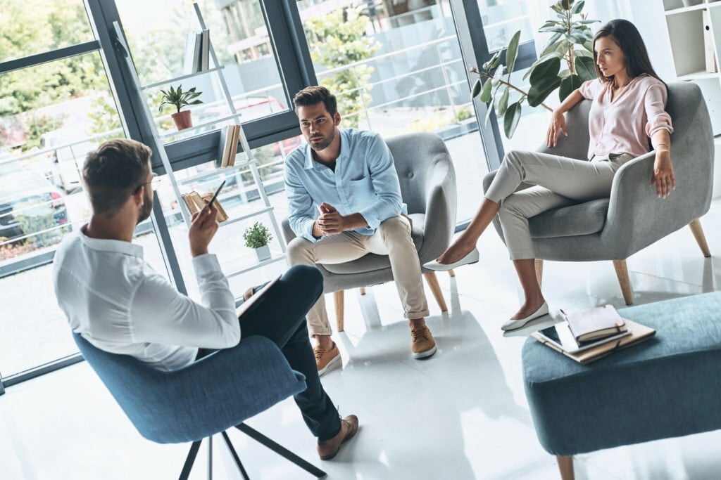 a group of people sitting in chairs