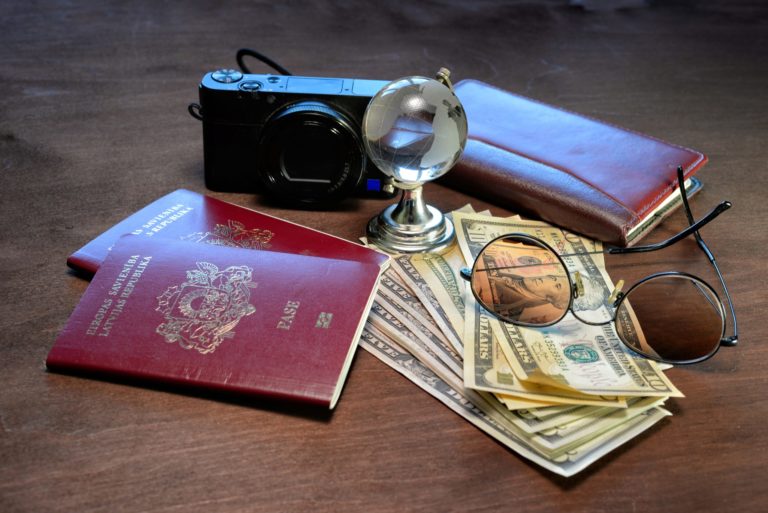 a camera and a book on a table