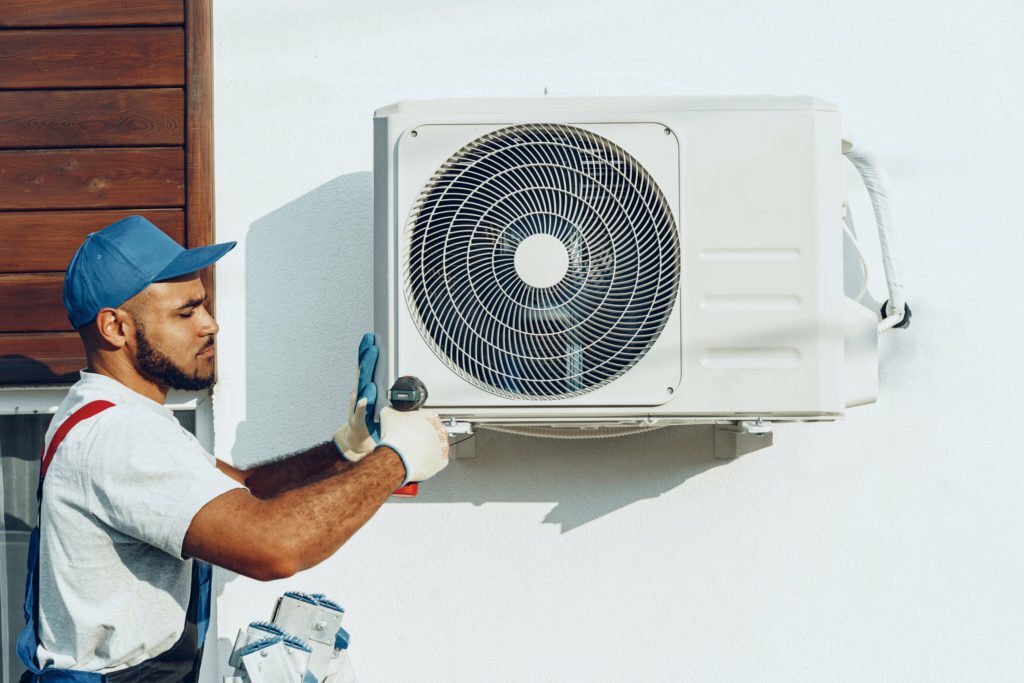 a man working on a washing machine