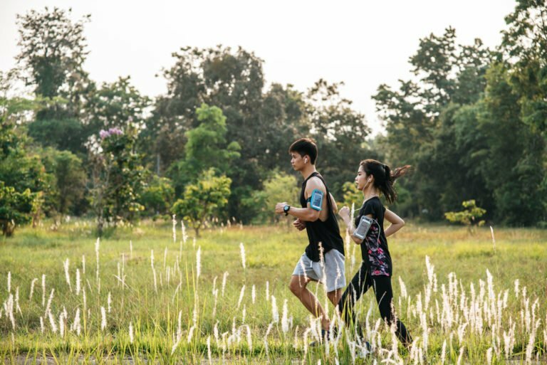 a group of people walking in a field