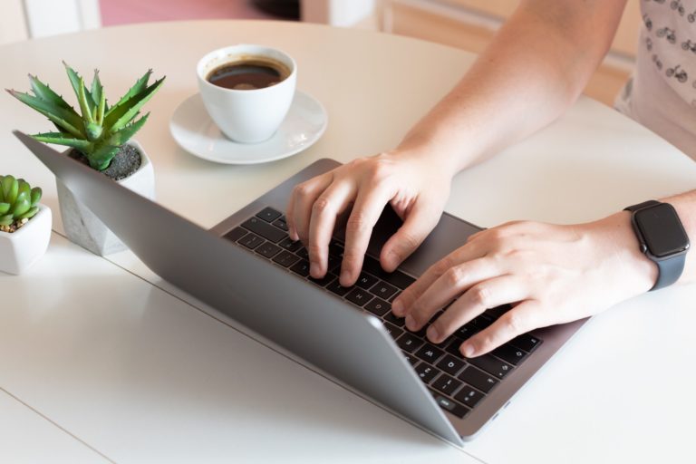 a close-up of a person using a laptop