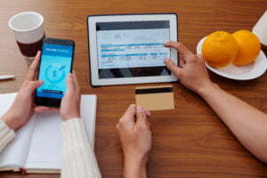 hands holding a tablet