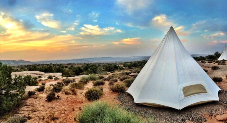 a white tent in a desert