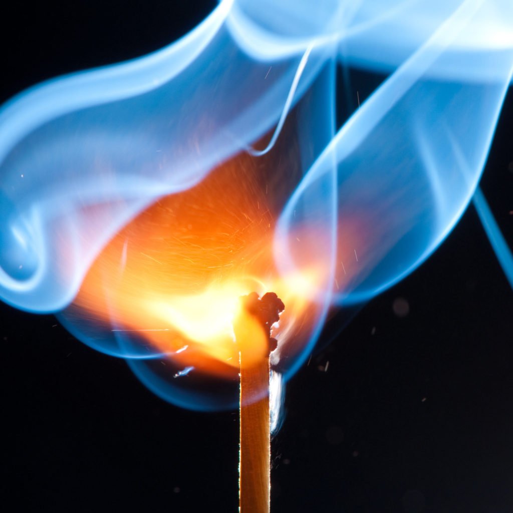 a close-up of a burning match