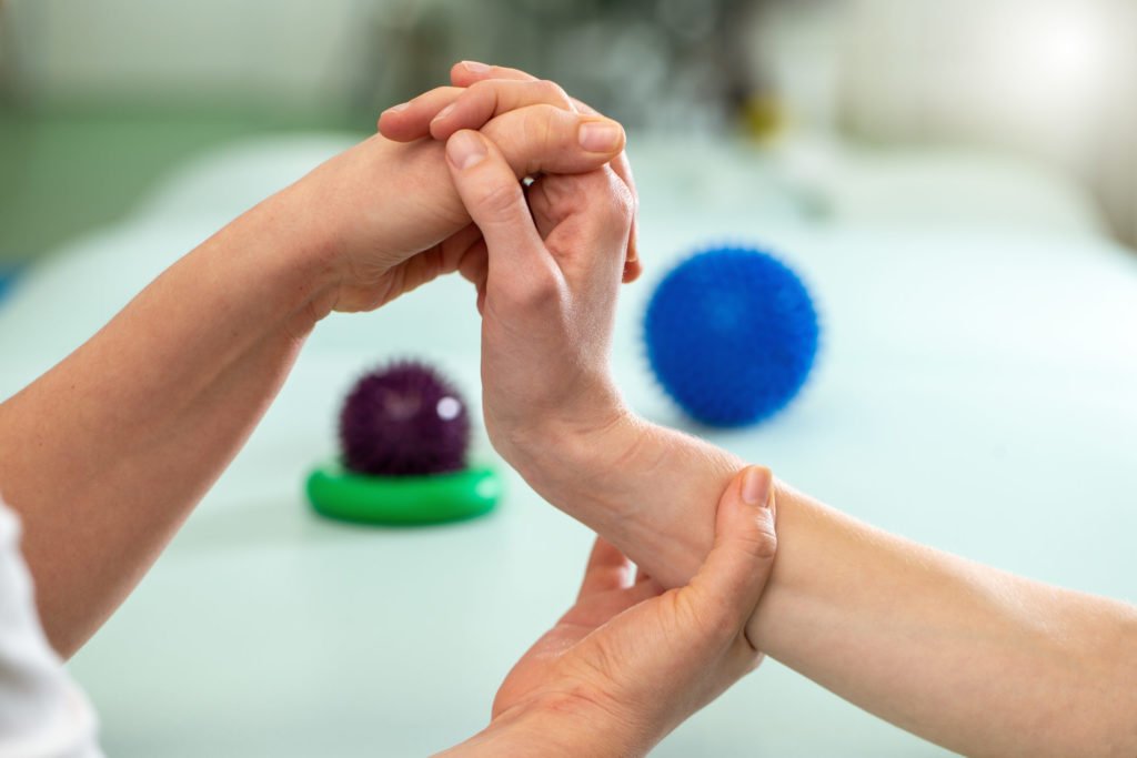 a close-up of hands holding a ball