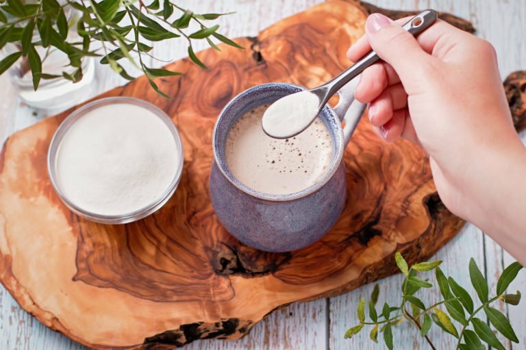 adding powder to a cup of coffee