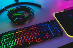 a computer keyboard with a mouse and a mouse on it