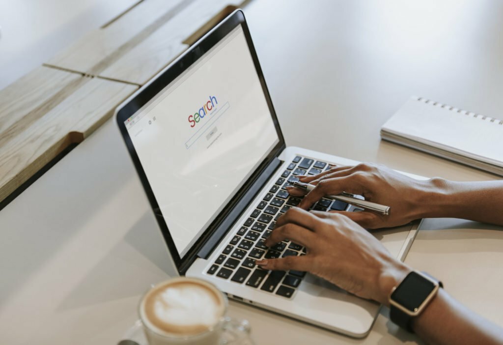 a person typing on a laptop