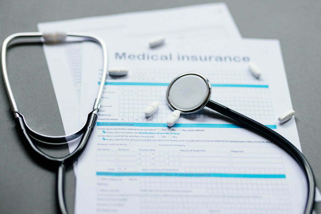 health insurance application. Stethoscope and health medical form