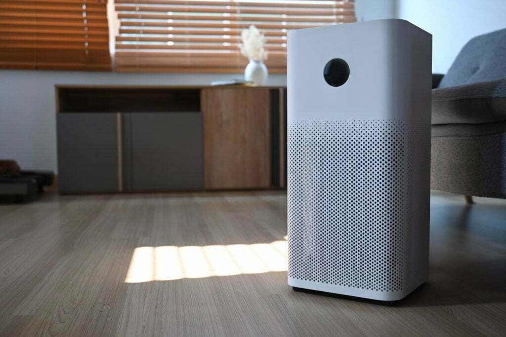 Indoor Air purifier on wooden floor in living room for filter .