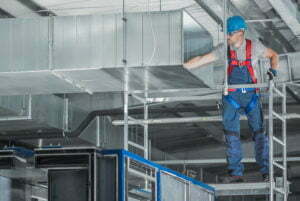 Installing HVAC System Air Circulation Duct Inside a Warehouse