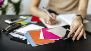 Designer with fabric samples