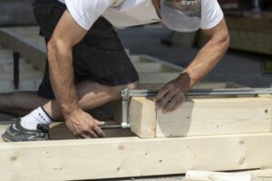 a man working on a piece of wood