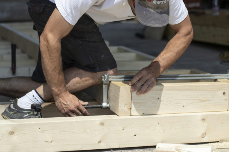 a man working on a piece of wood