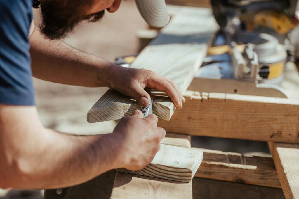 a man cutting wood